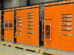 Orange electrical panels in a workshop.
